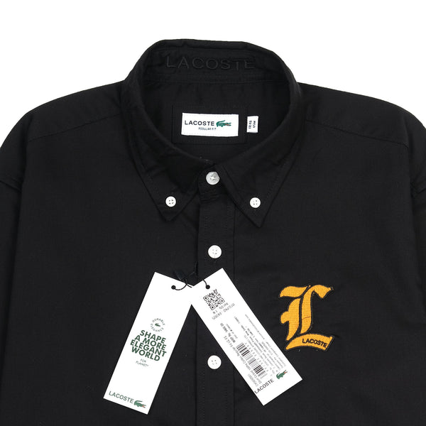 Lacoste Elegant Black Button-Up Shirt with Golden Emblem